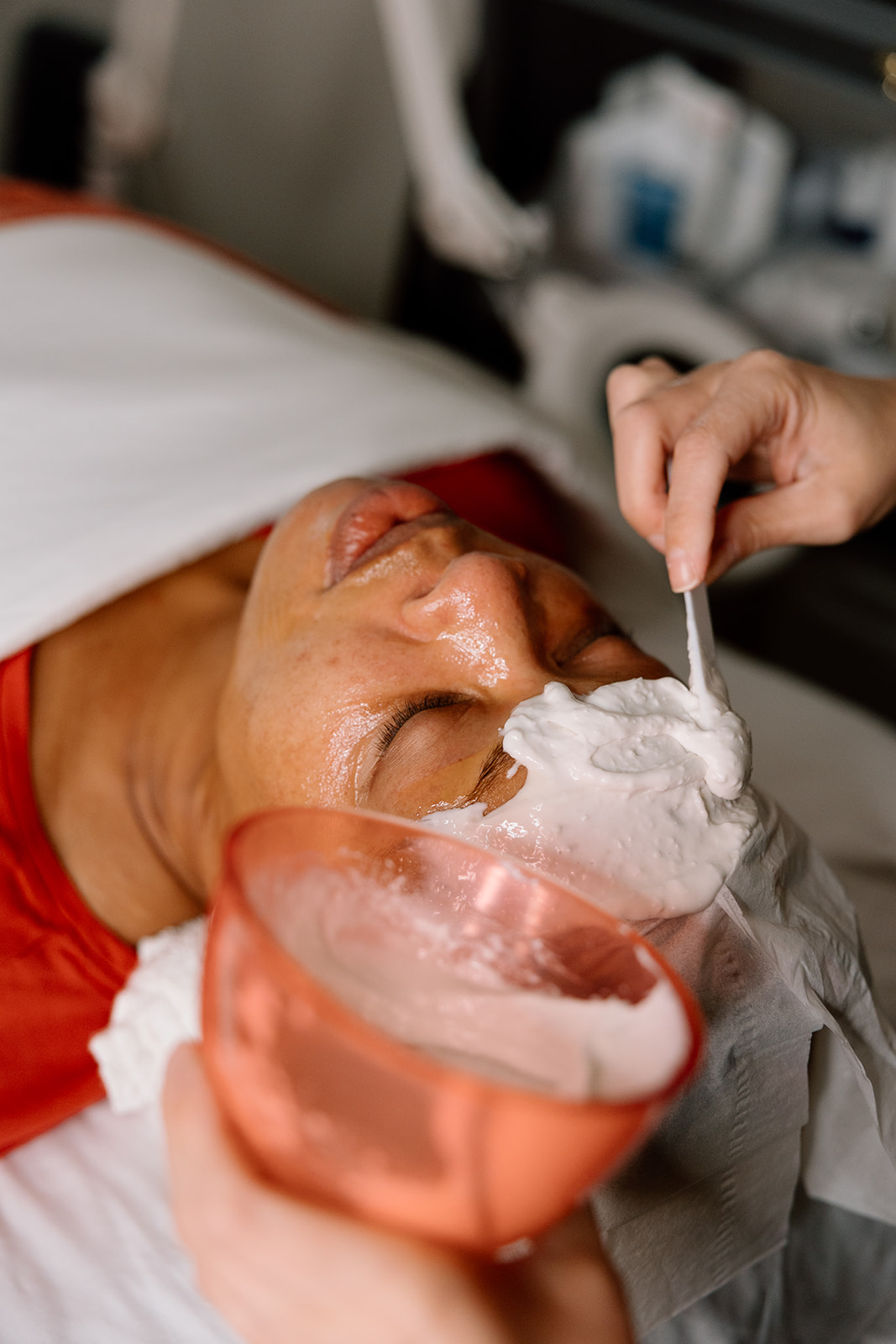 DF Environ Focus on Filler Facial with Alginate Mask being applied on a woman's face.