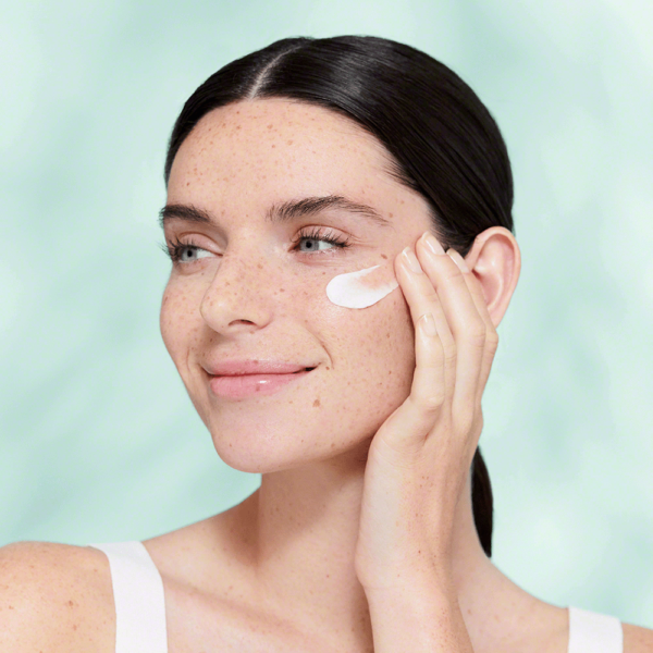 Woman applying DetO2x Cream
