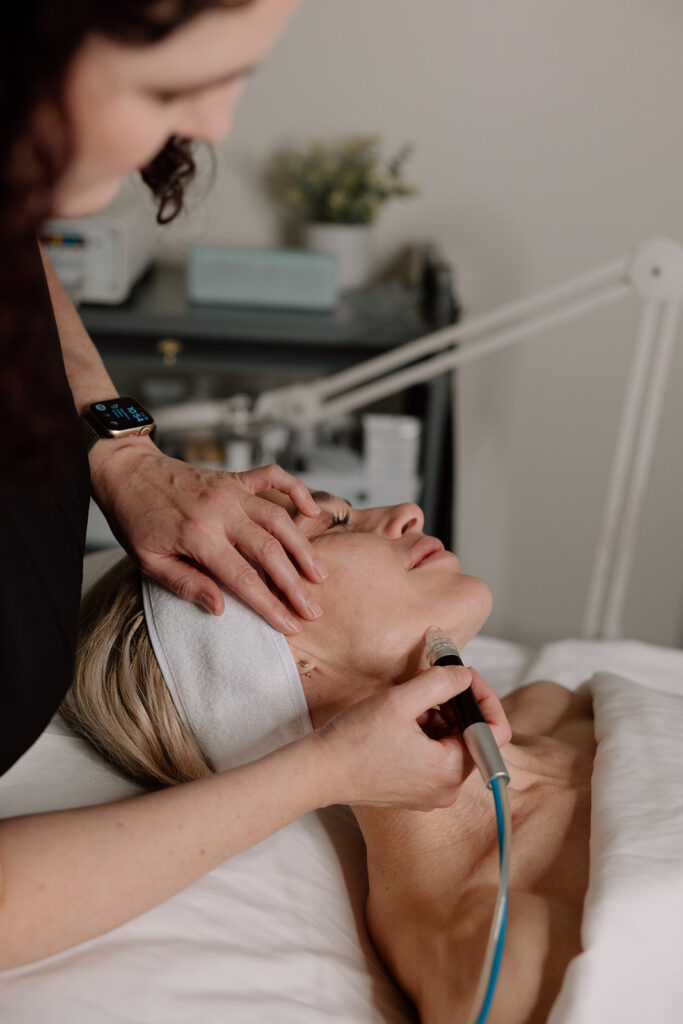 esthetician providing hydroderm facial