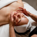 a woman is enjoying the a facial. EA's guiding principles include feeling beautiful in your own skin