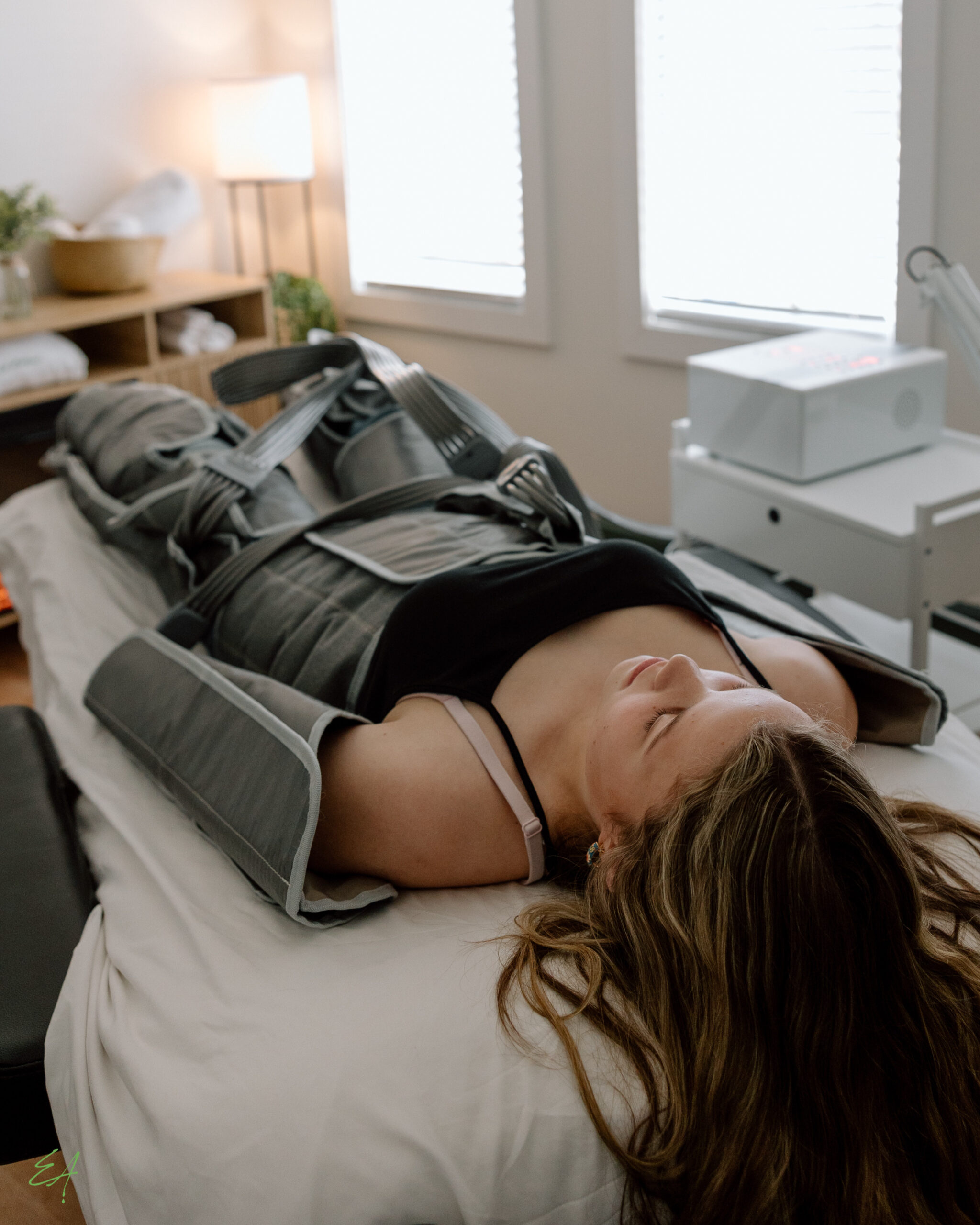 A woman gets lymphatic drainage with our pressotherapy lymphatic drainage suit